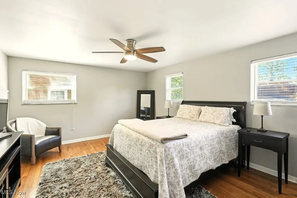 Bedroom featuring light wood finished floors and a ceiling fan