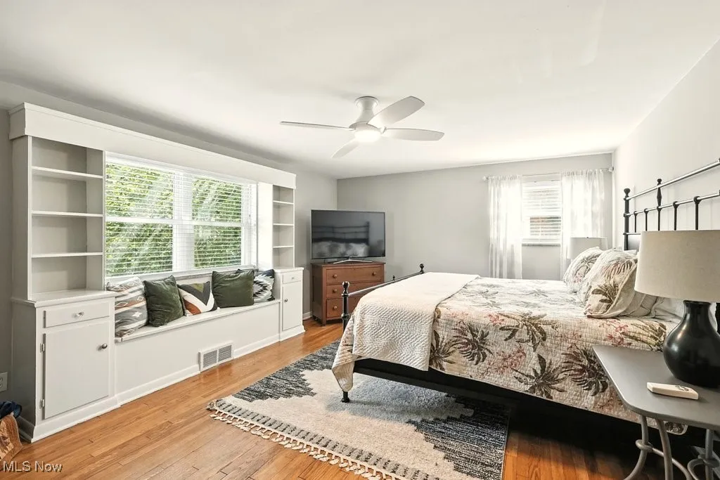 Bedroom featuring light wood-type flooring and ceiling fan