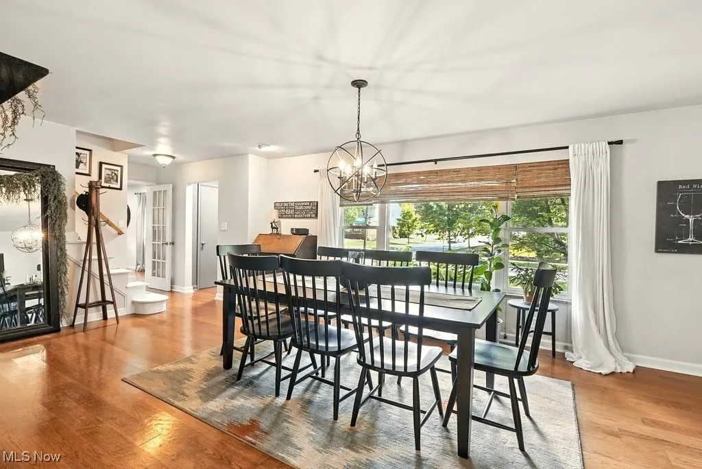Dining room featuring a chandelier and light wood-style flooring