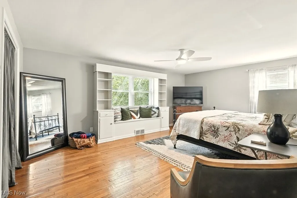 Bedroom featuring light wood-type flooring and ceiling fan