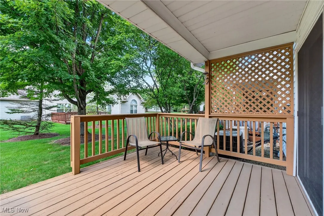 Wooden deck featuring a yard