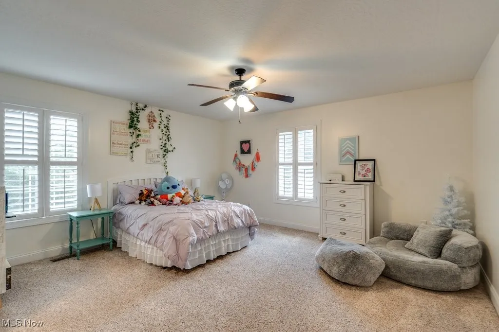 Bedroom featuring carpet and a ceiling fan