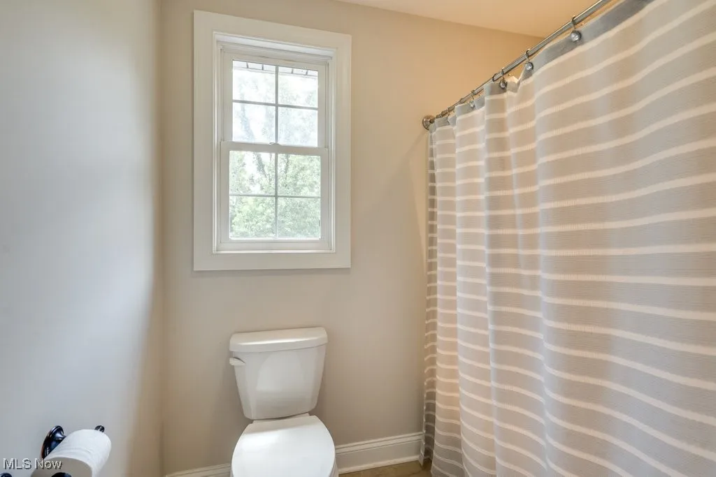 Bathroom with a shower with curtain