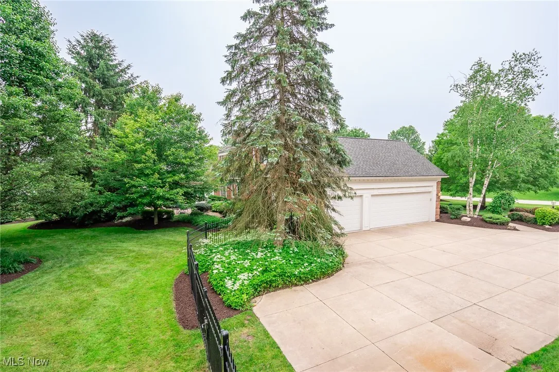 Large 3 car garage with oversized top of driveway.