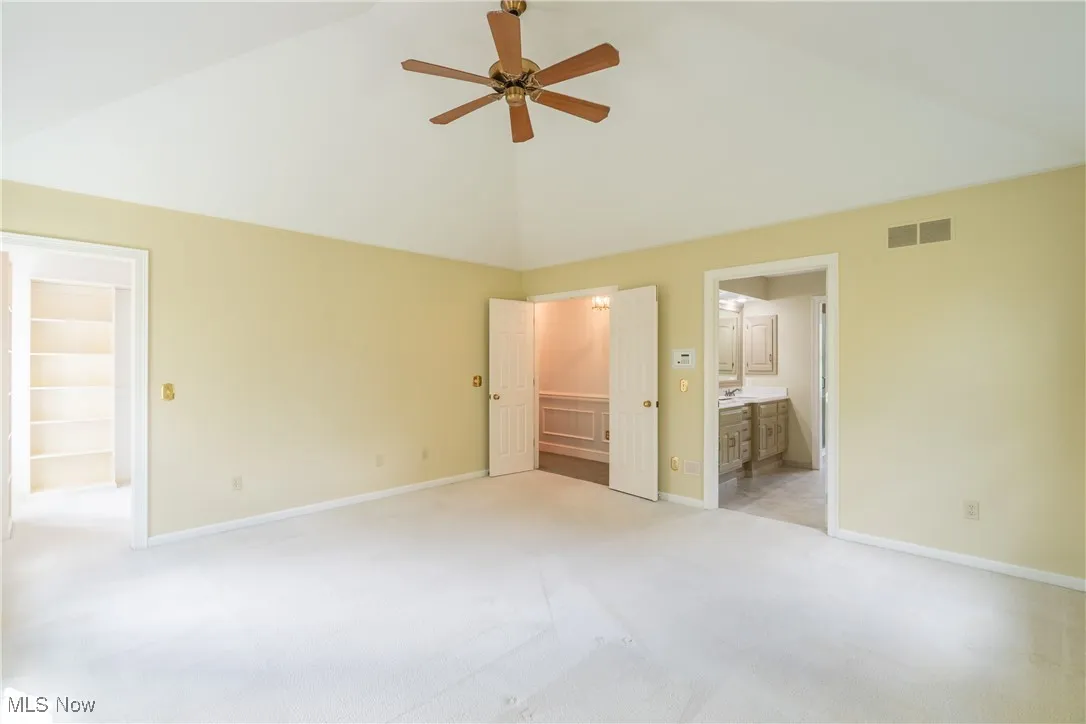 Double doors into the Owner's suite with two walk in closets.