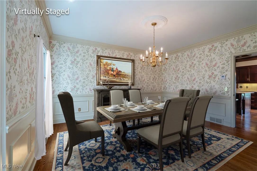 Formal Dining Room with hardwood floors and  beautiful painted moldings