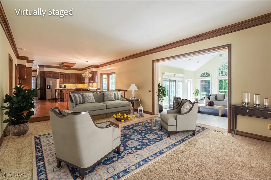 Family Room with brick fireplace and custom built cherry bookshelves.