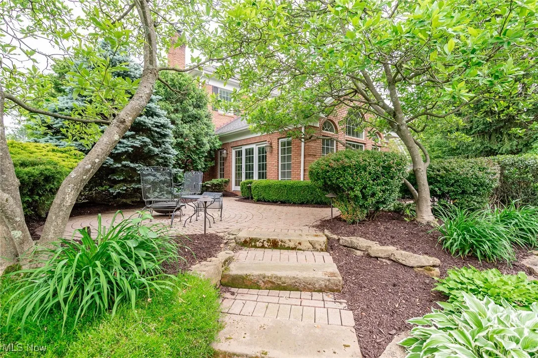 Brick walkways and steps accent the two brick patios.