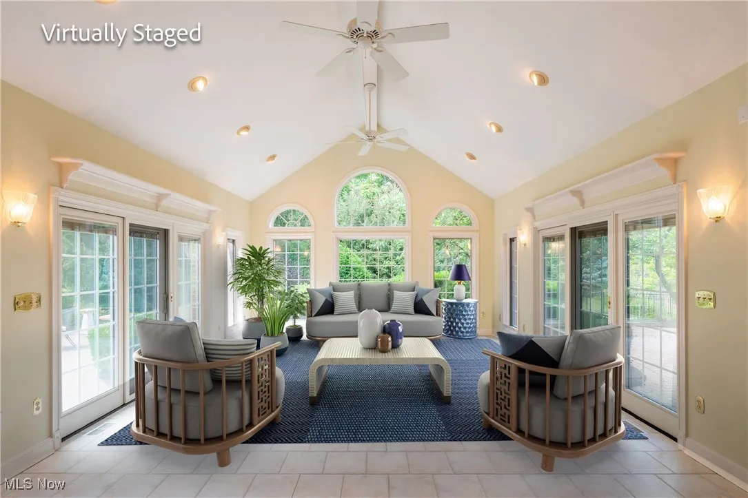 WOW...Addition of a four season tiled sunroom with vaulted ceilings.