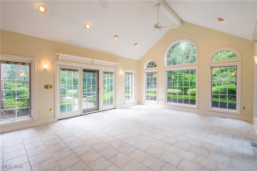 Sunrrom opens to a lovely brick patio on each side.