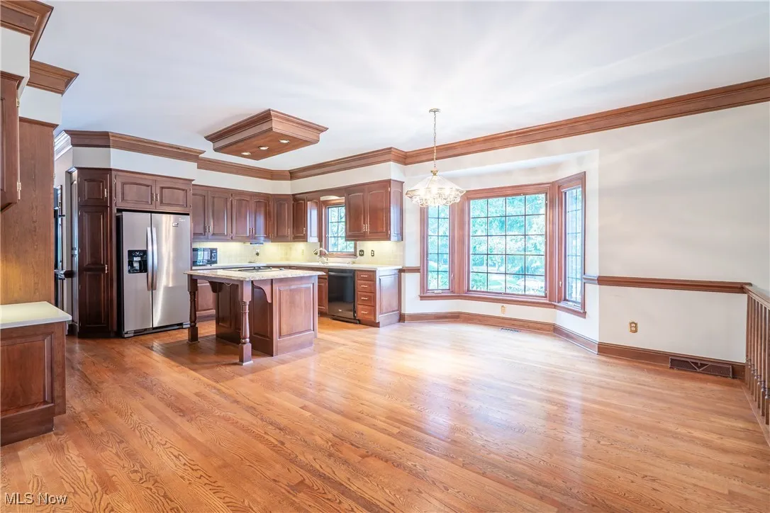 The heart of the home, Spacious Kitchen with hardwood floors and high quality Schrock cherry cabinetry,