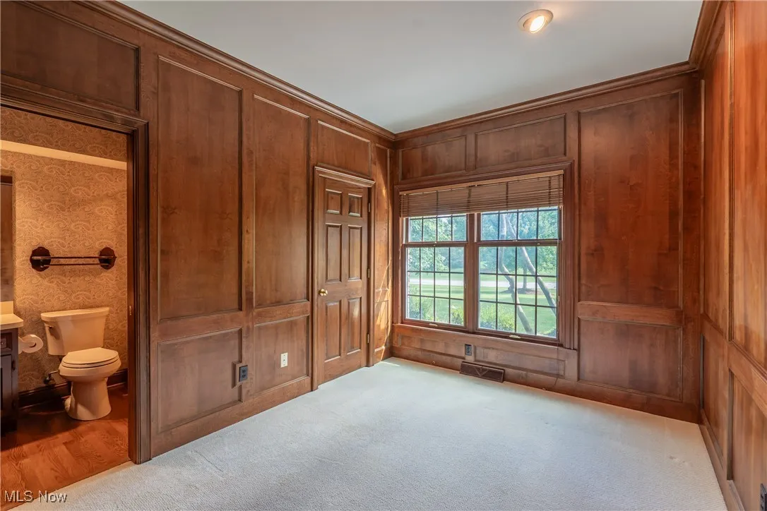 Cherry paneled private office with closet and full bath.  Could also make a great first floor bedroom.