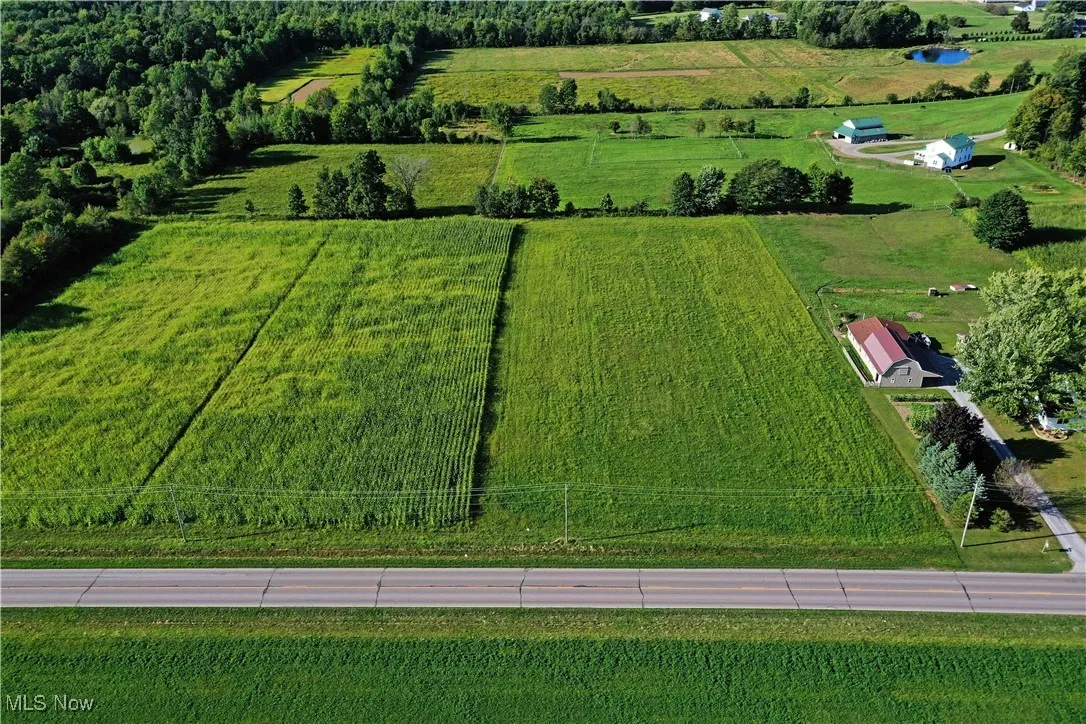 Aerial view of sparsely populated area with large plots for crops
