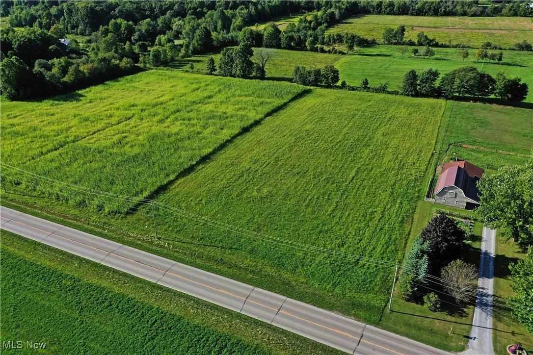 Aerial view of sparsely populated area with extensive farmland