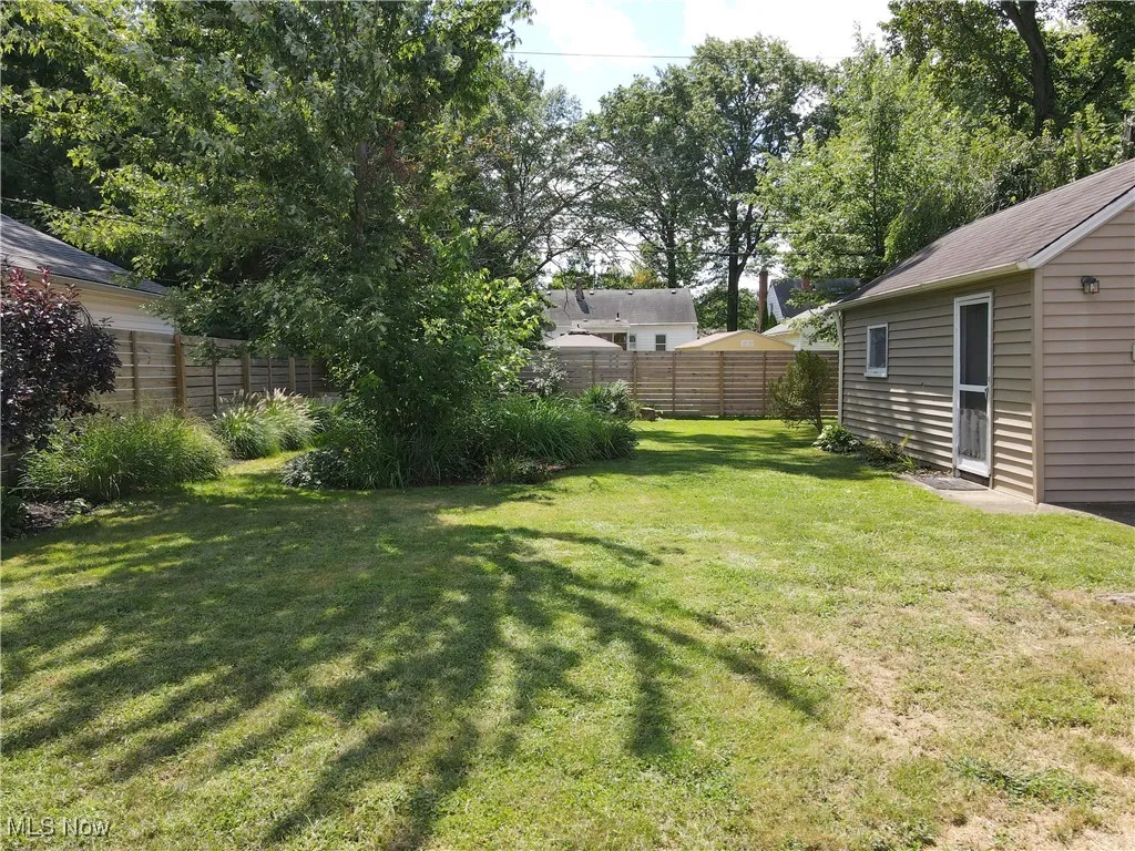 View of fenced backyard