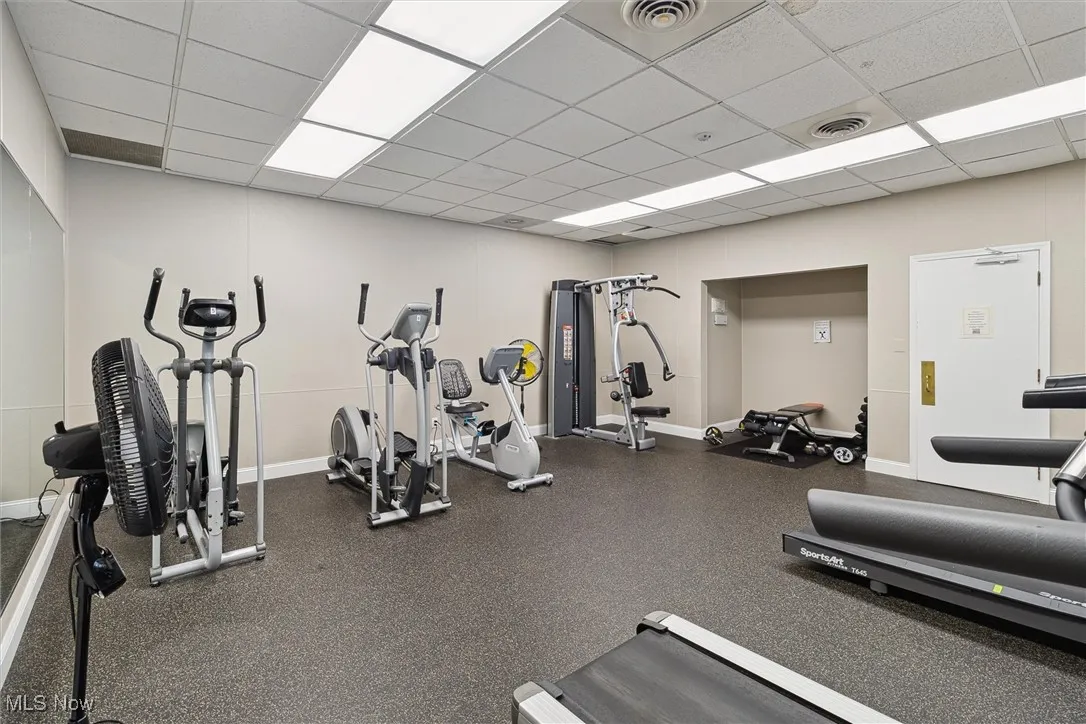 Workout area with a paneled ceiling