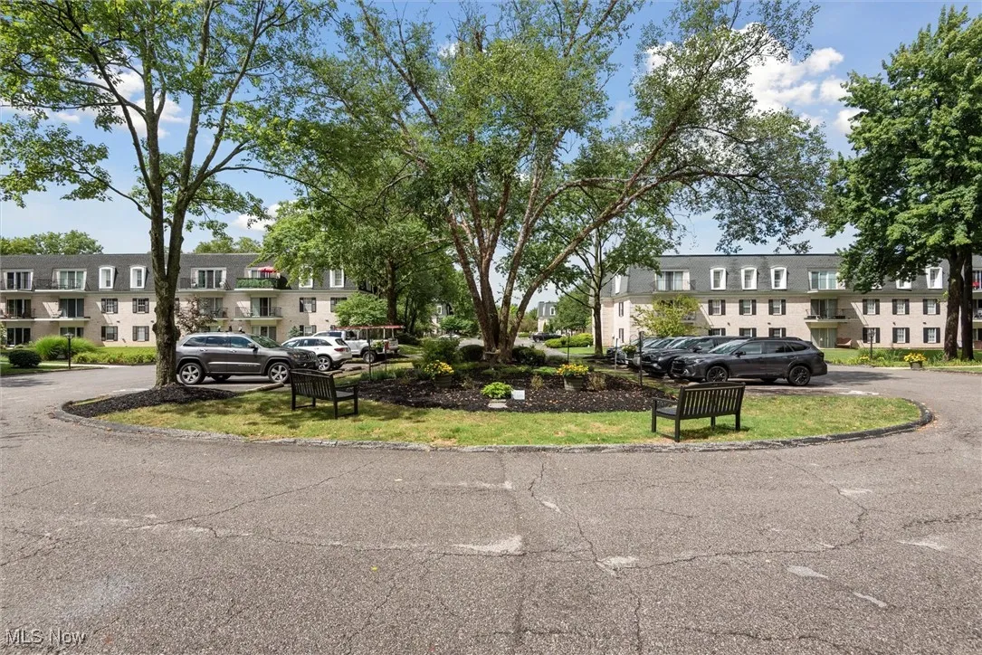View of home's community with uncovered parking