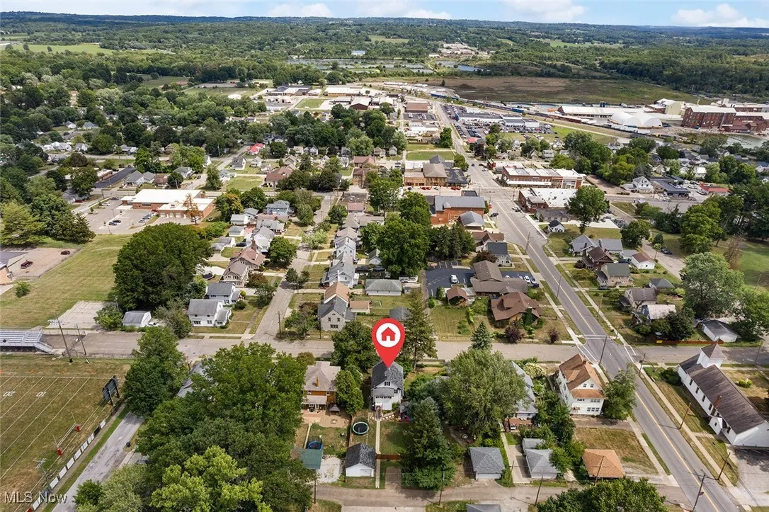 View of property location with nearby suburban area