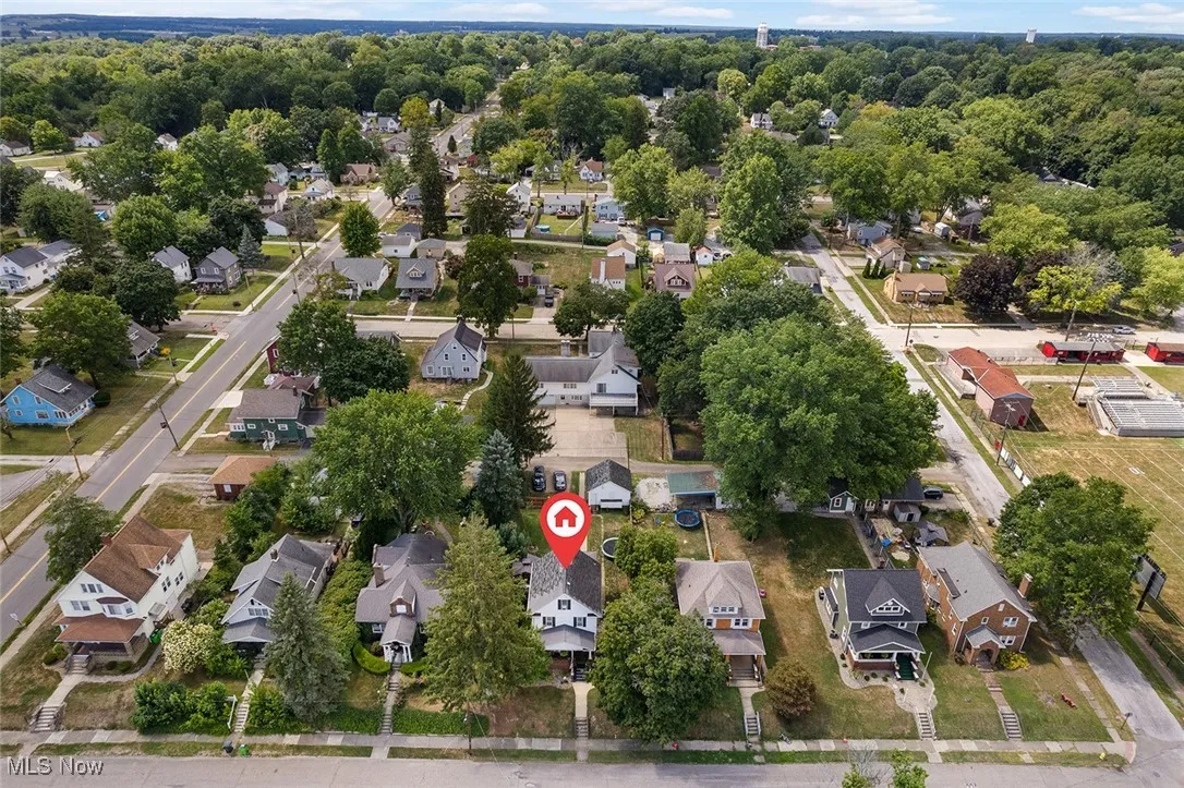 Aerial view of property's location with nearby suburban area