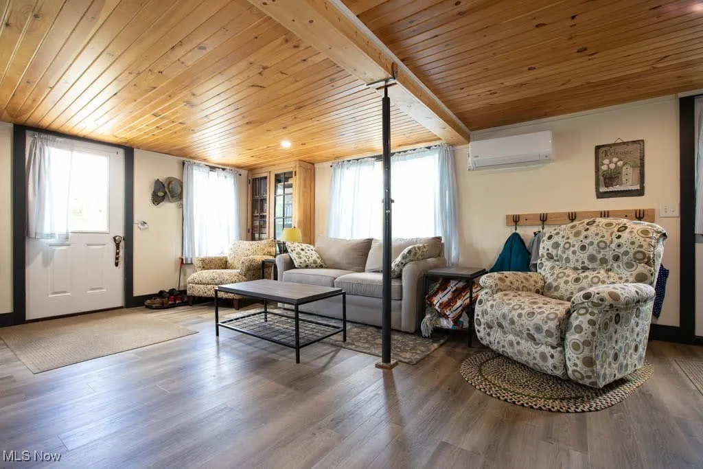 MUD ROOM AT REAR OF HOME WITH WOOD CEILINGS.
