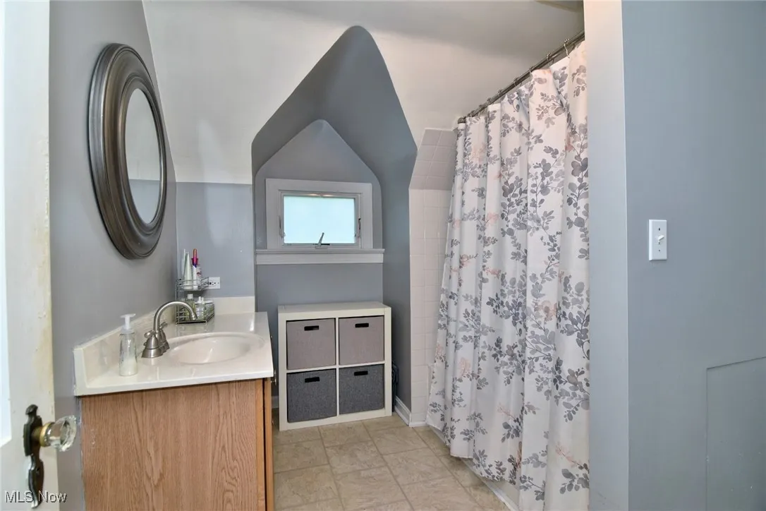 2nd floor full Bathroom with vanity, light tile patterned floors, and a stall shower