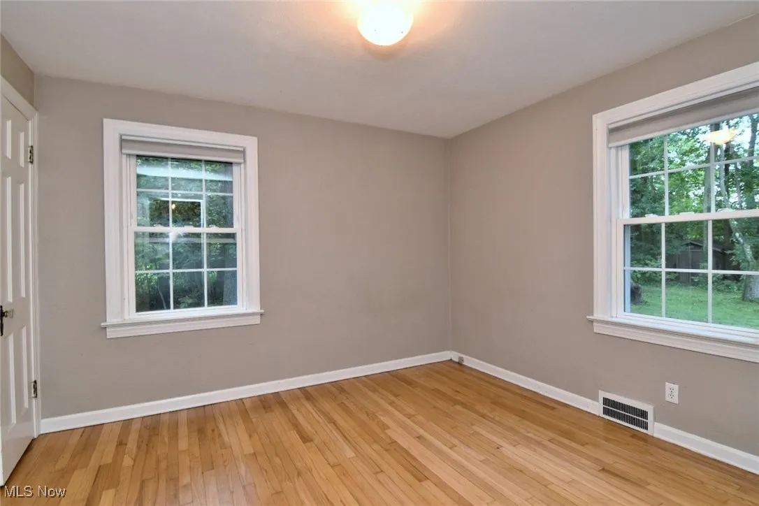 first floor light wood flooring and healthy amount of natural light