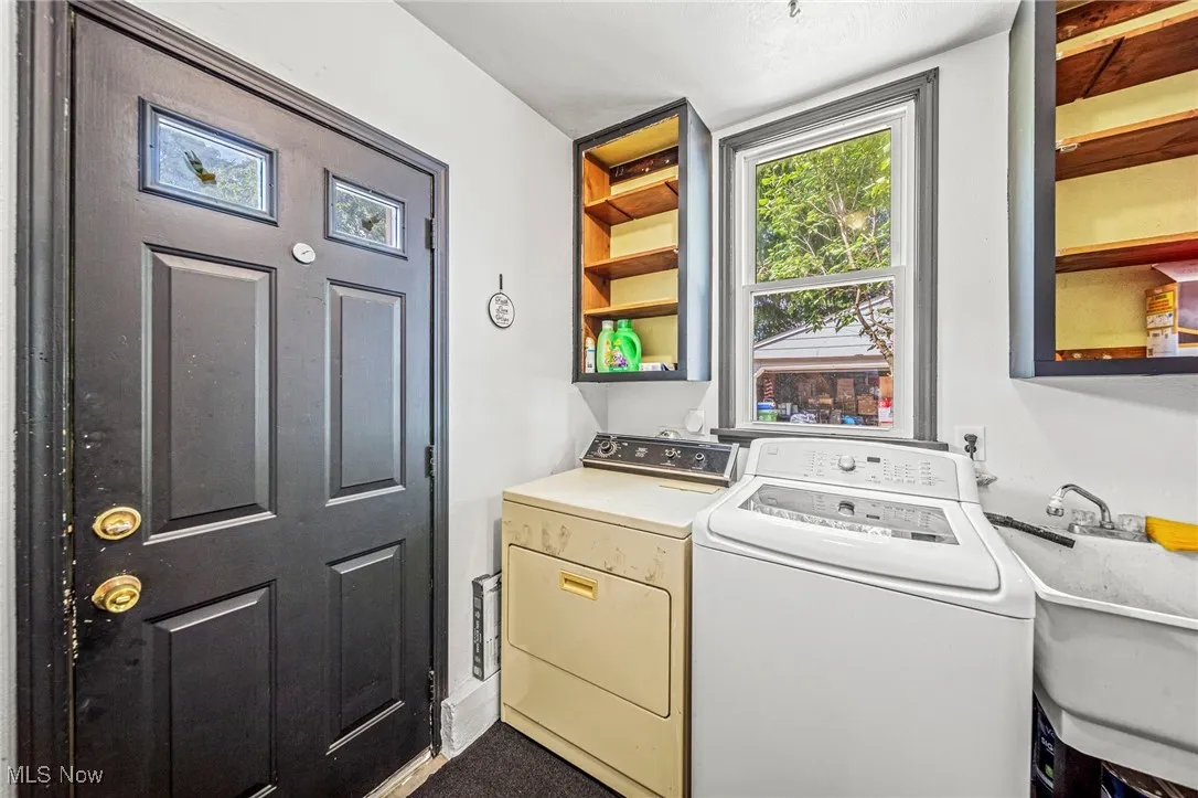 Washroom featuring washer and dryer