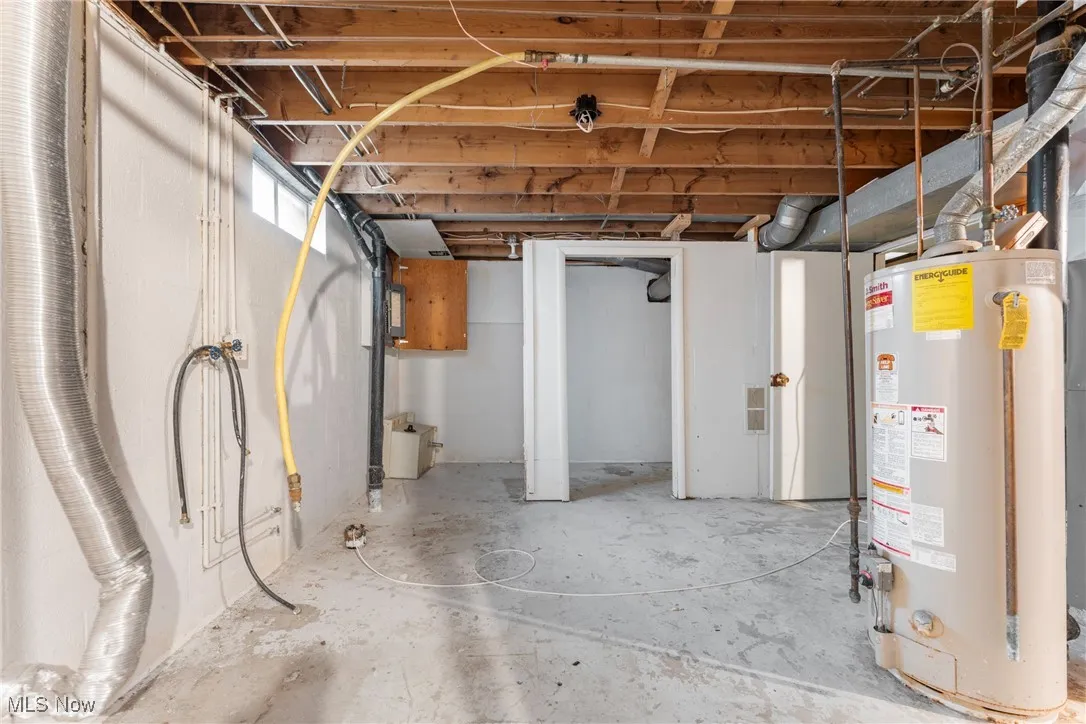 Below grade area featuring gas water heater