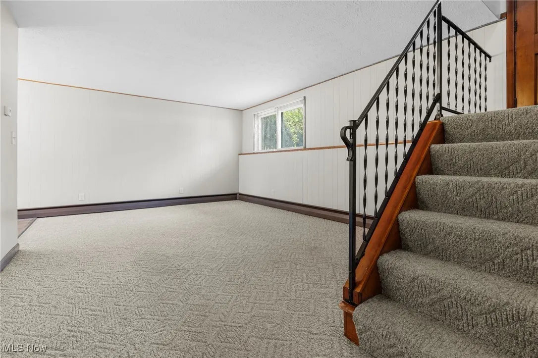 Enter through the front door, few steps down into the family room, or few step up to the second floor