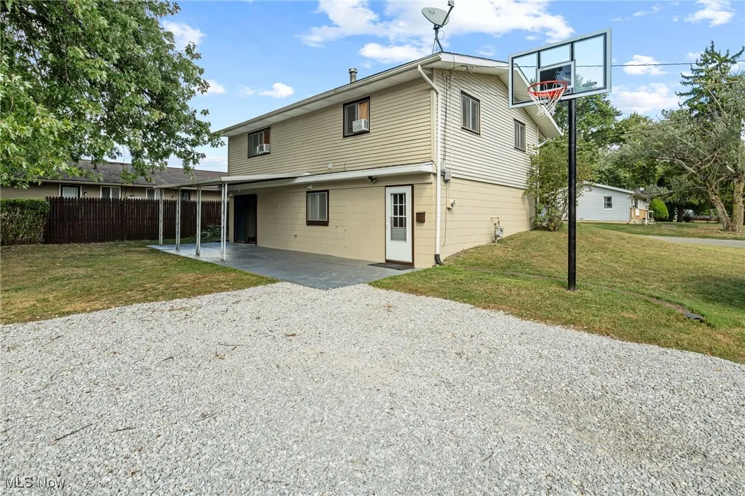 Back of home with covered patio