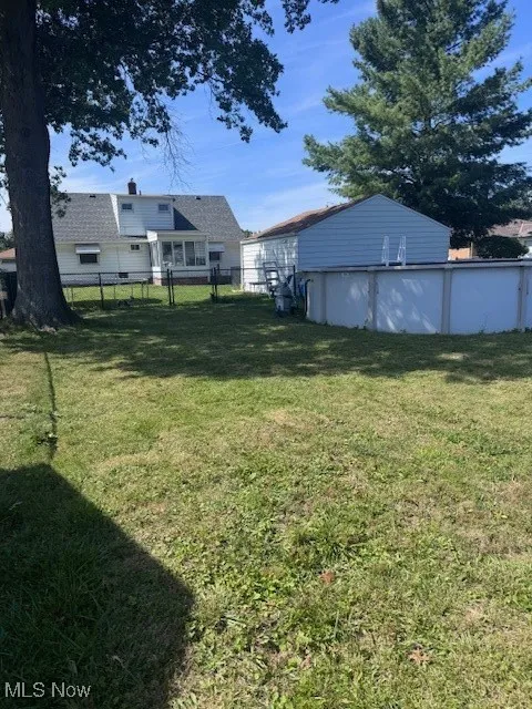 View of yard with an outdoor pool