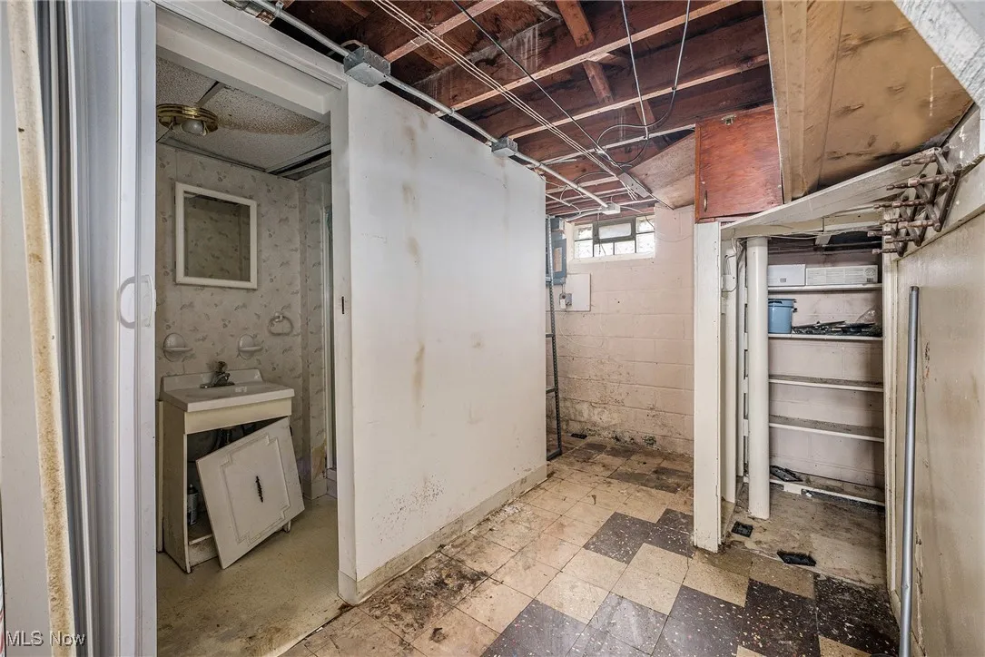 Basement featuring light floors