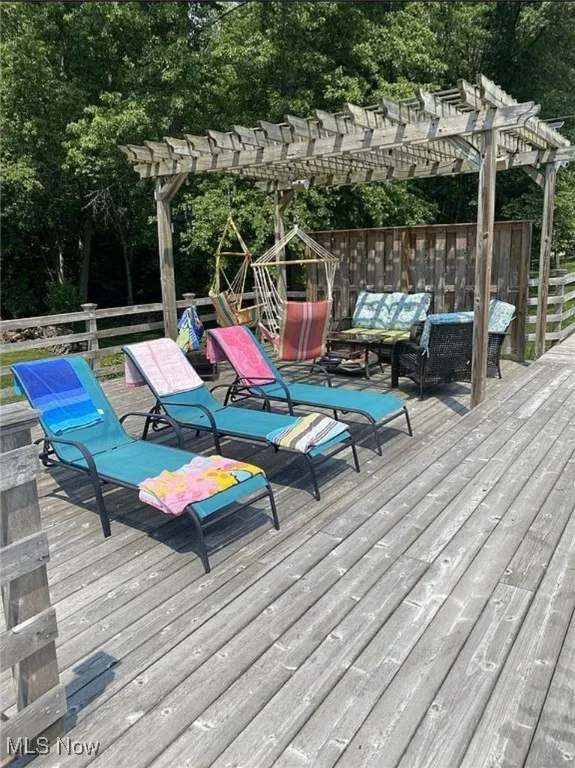 Deck featuring a pergola