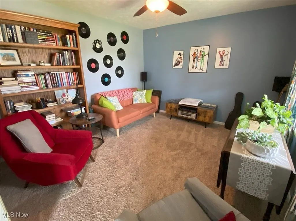 Sitting room with carpet floors and ceiling fan