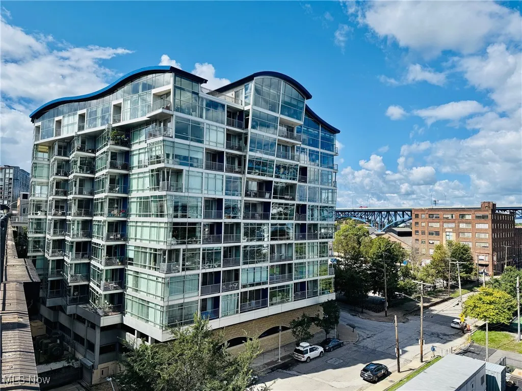View of apartment building / complex featuring a city view