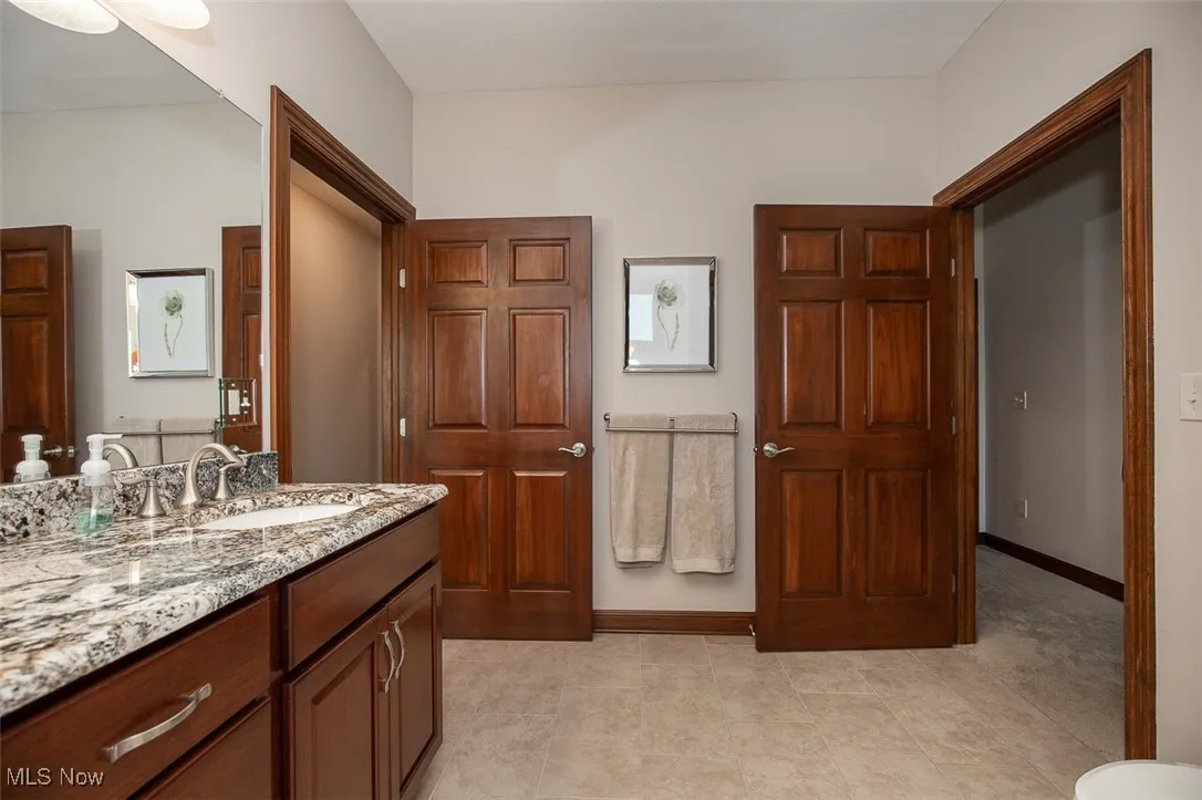 Bathroom with vanity and light tile patterned floors