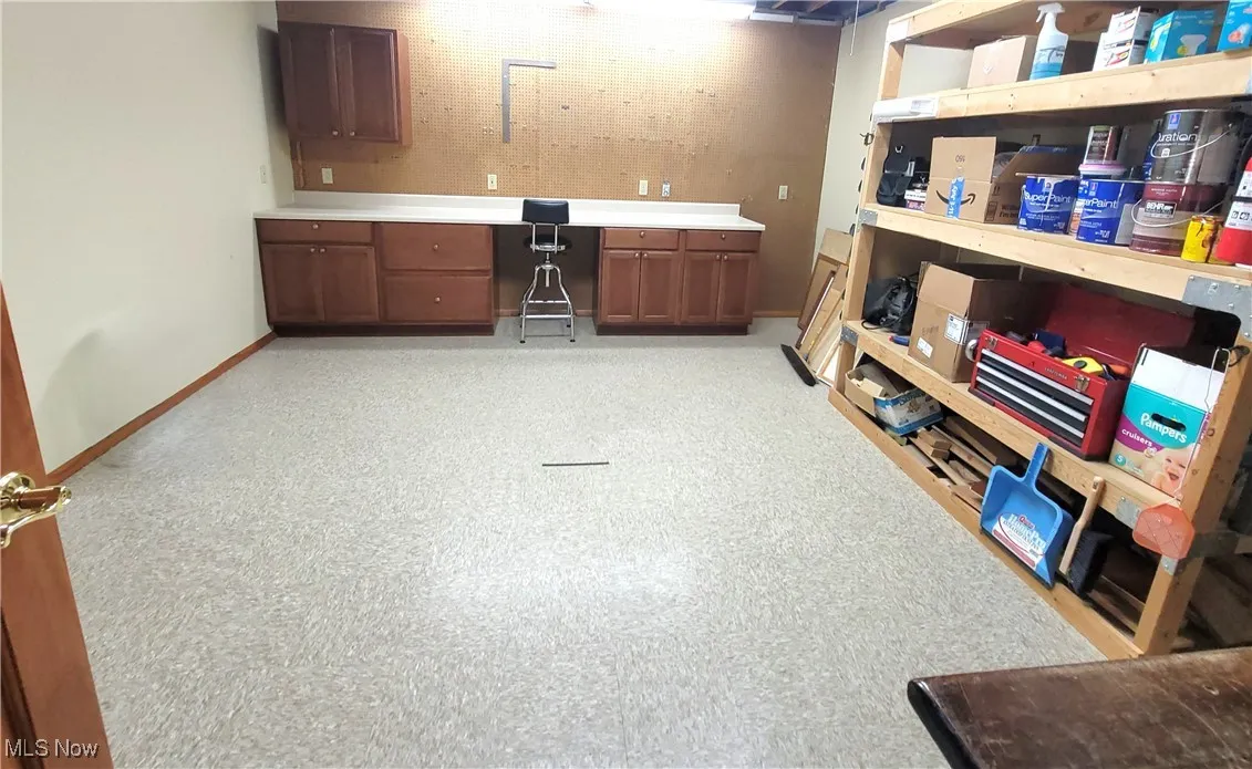 Basement featuring baseboards