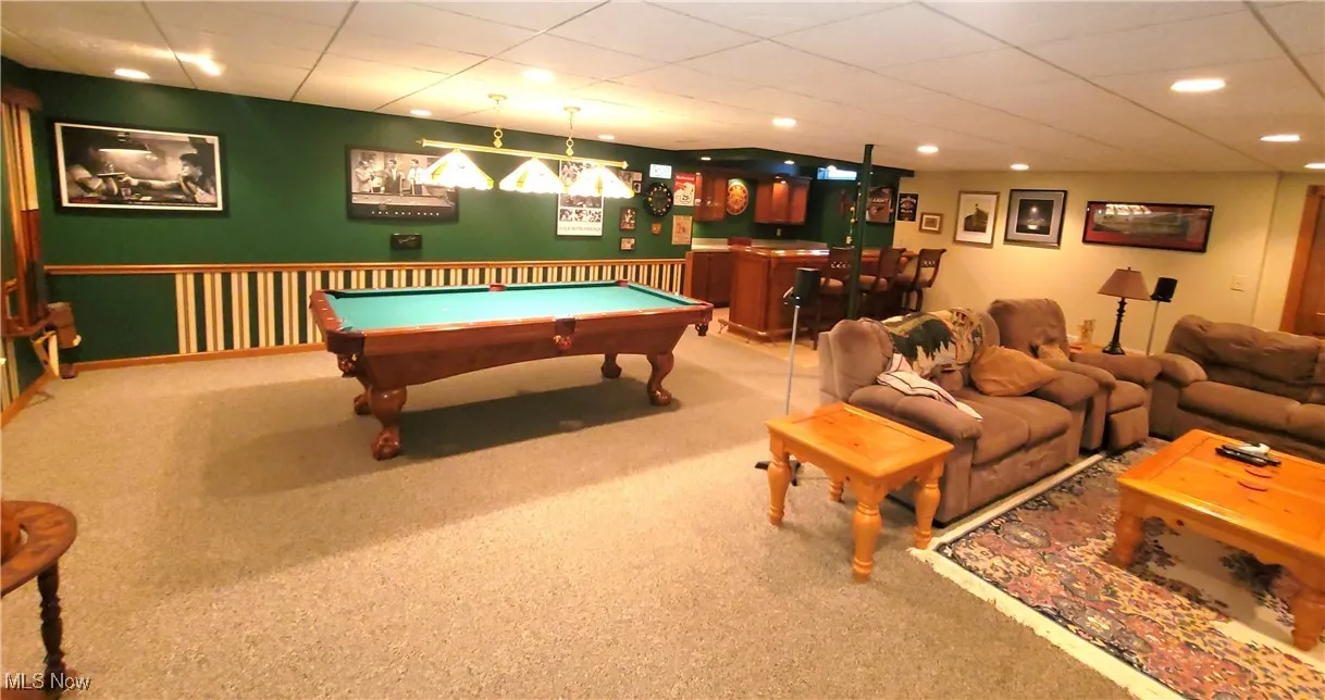Recreation room featuring carpet, pool table, a paneled ceiling, recessed lighting, and bar
