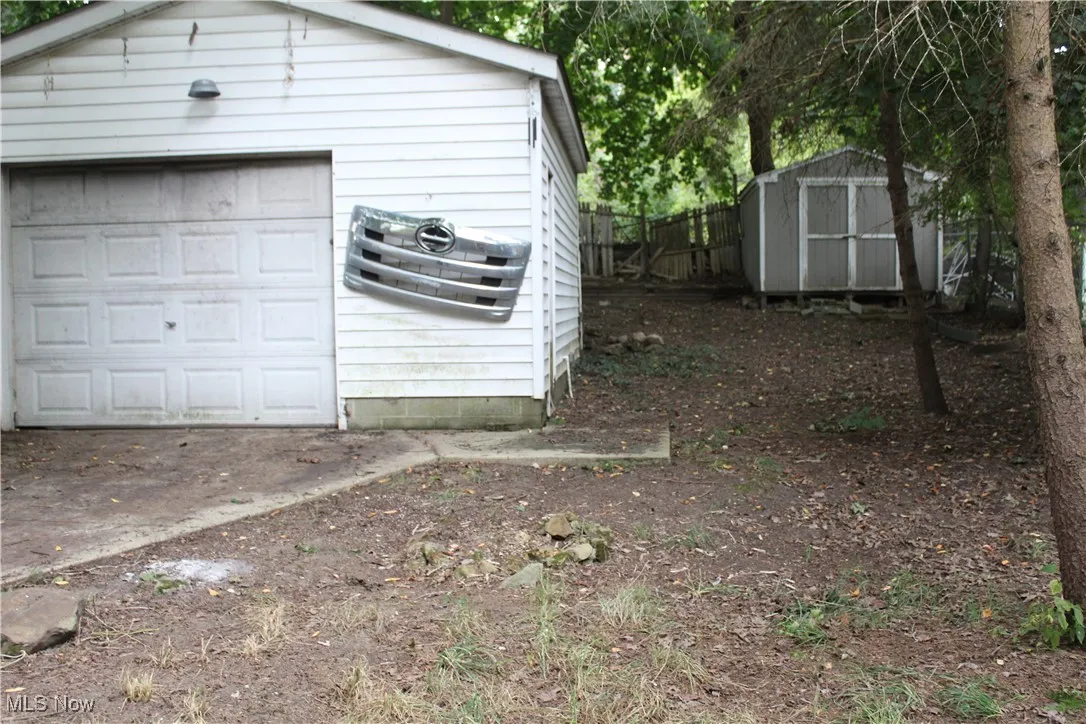 Detached garage with a storage shed