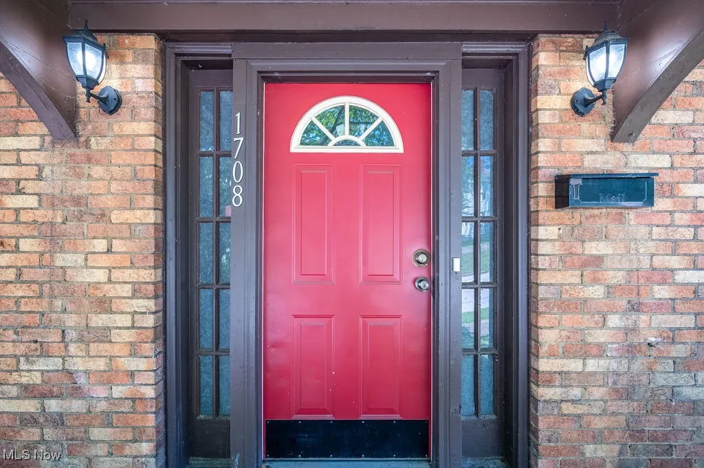 Property entrance with brick siding