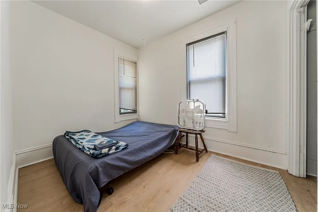 Bedroom featuring light wood-style floors and baseboards