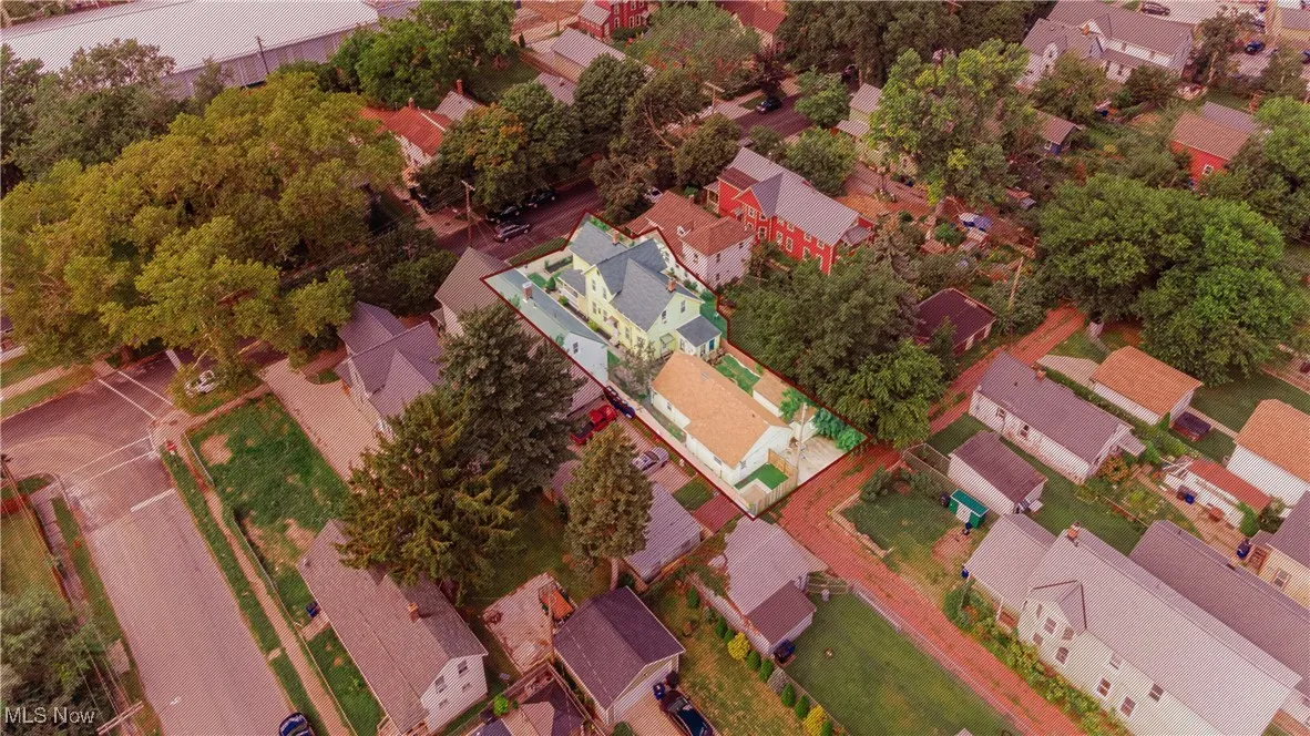 Aerial view of property's location featuring nearby suburban area