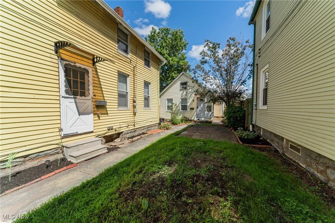View of yard with entry steps