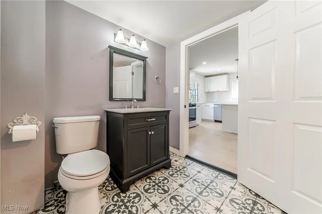 Bathroom with vanity and light tile patterned flooring