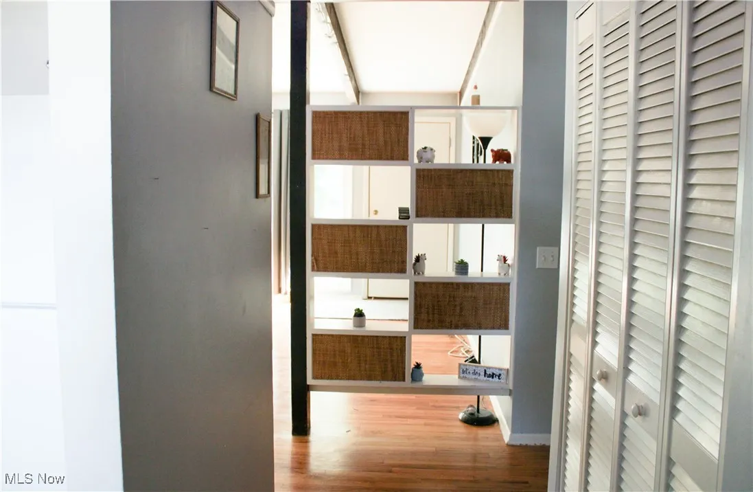Hallway featuring wood finished floors