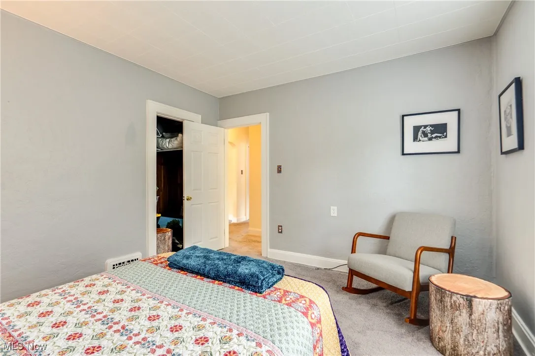 Bedroom with carpet flooring and baseboards