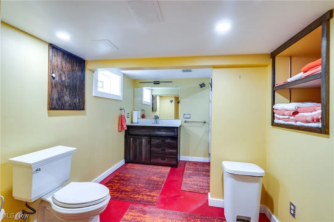 Full bathroom with vanity and baseboards walk in shower