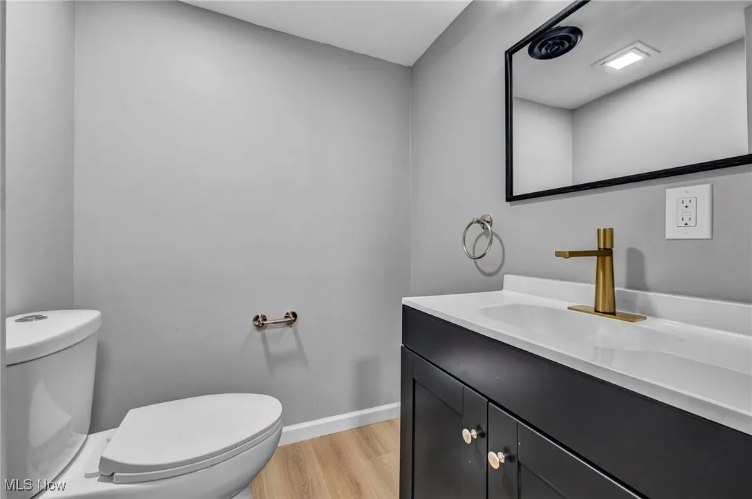 Bathroom with vanity and light wood-style floors