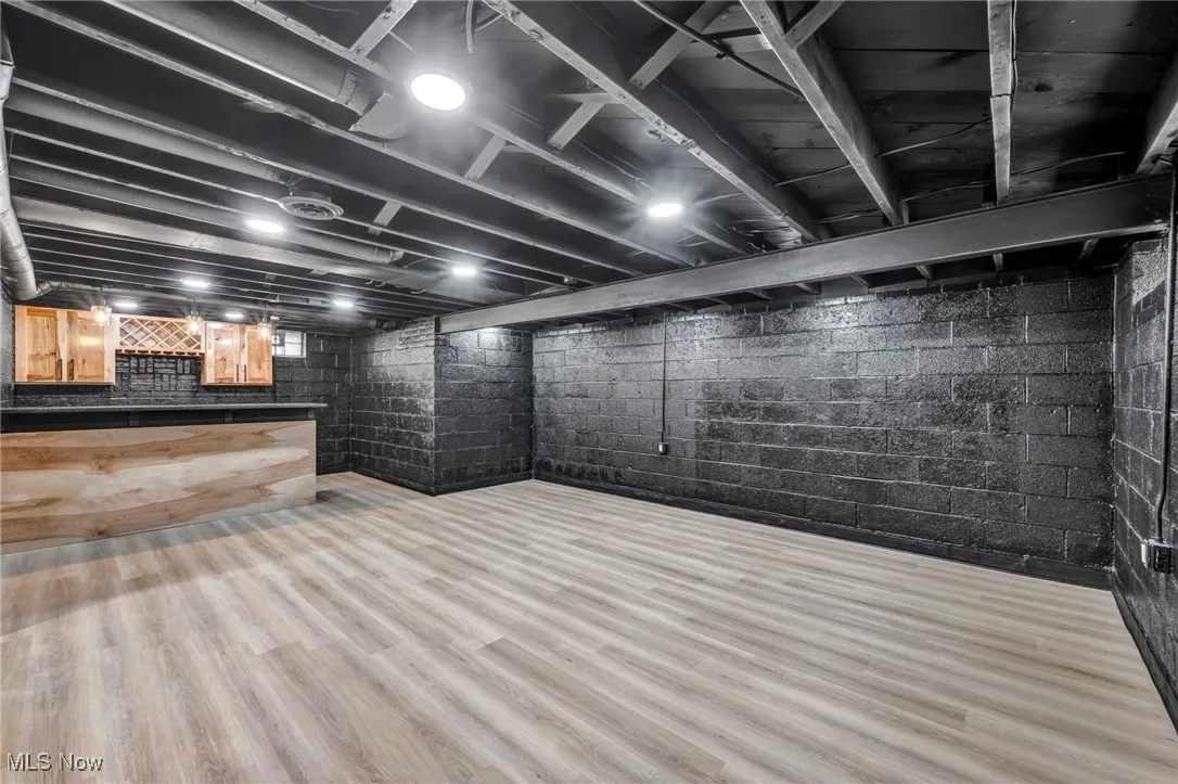 Finished below grade area featuring light wood-type flooring