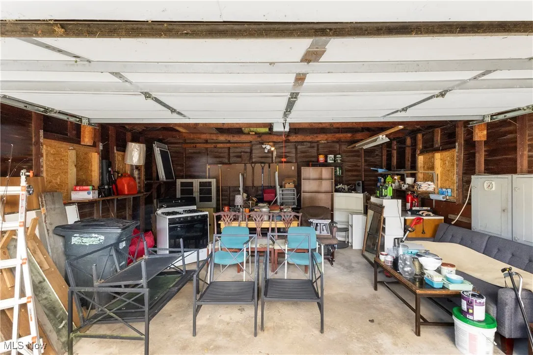 Garage featuring wooden walls